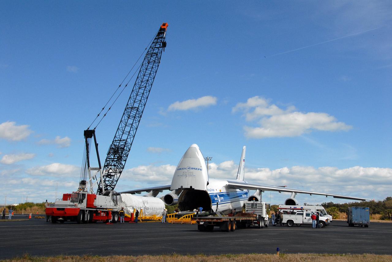 CAPE CANAVERAL, Fla. – – On Cape Canaveral Air Force Station's skid strip in Florida, the crane at left will lift the Centaur stage of the Atlas V rocket below it to place it on the flatbed truck at right. The Centaur arrived at CCAFS aboard the Russian AH-124-100 aircraft. The Centaur will be transported to the Astrotech facility in Titusville, Fla. The Atlas V will launch NASA's Lunar Reconnaissance Orbiter, or LRO, and NASA's Lunar CRater Observation and Sensing Satellite, known as LCROSS. The two spacecraft will be integrated with the Atlas V and tested for final flight worthiness. Launch is scheduled for the spring. LCROSS and LRO are the first missions in NASA's plan to return humans to the moon and begin establishing a lunar outpost by 2020. Photo credit: NASA/Cory Huston
