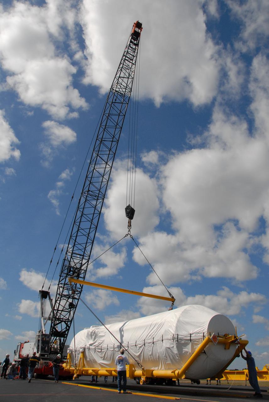 CAPE CANAVERAL, Fla. – On Cape Canaveral Air Force Station's skid strip in Florida, the crane is attached to the Centaur stage of the Atlas V rocket to lift and place it on a flatbed truck. The Centaur will be transported to the Astrotech facility in Titusville, Fla. The Atlas V will launch NASA's Lunar Reconnaissance Orbiter, or LRO, and NASA's Lunar CRater Observation and Sensing Satellite, known as LCROSS. The two spacecraft will be integrated with the Atlas V and tested for final flight worthiness. Launch is scheduled for the spring. LCROSS and LRO are the first missions in NASA's plan to return humans to the moon and begin establishing a lunar outpost by 2020. Photo credit: NASA/Cory Huston