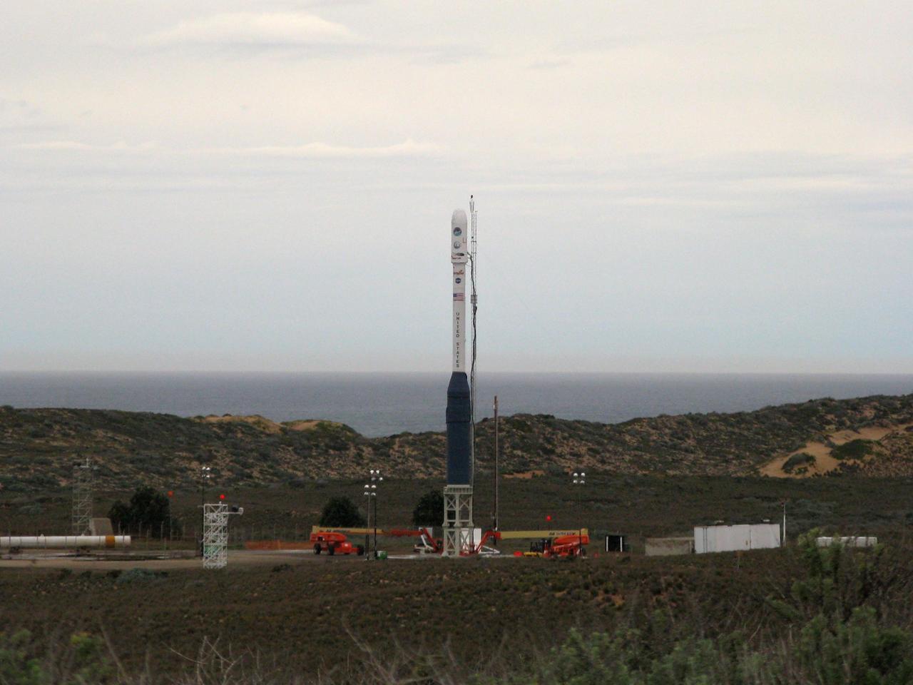 VANDENBERG AIR FORCE BASE, Calif. -- On Launch Complex 576-E at Vandenberg Air Force Base in California, NASA's Orbiting Carbon Observatory, or OCO, atop Orbital Sciences' Taurus XL rocket has been erected for launch.  Around the spacecraft's fairing, at top, is the non-flight environmental shield that will be removed before launch. OCO is scheduled for launch the Taurus rocket Feb. 24 from Vandenberg. The spacecraft will collect precise global measurements of carbon dioxide (CO2) in the Earth's atmosphere. Scientists will analyze OCO data to improve our understanding of the natural processes and human activities that regulate the abundance and distribution of this important greenhouse gas.  Photo courtesy of Brett Gladish, Orbital Sciences  The two spacecraft will be integrated with the Atlas V and tested for final flight worthiness. Launch is scheduled for the spring.  LCROSS and LRO are the first missions in NASA's plan to return humans to the moon and begin establishing a lunar outpost by 2020. Photo courtesy of Brett Gladish, Orbital Sciences