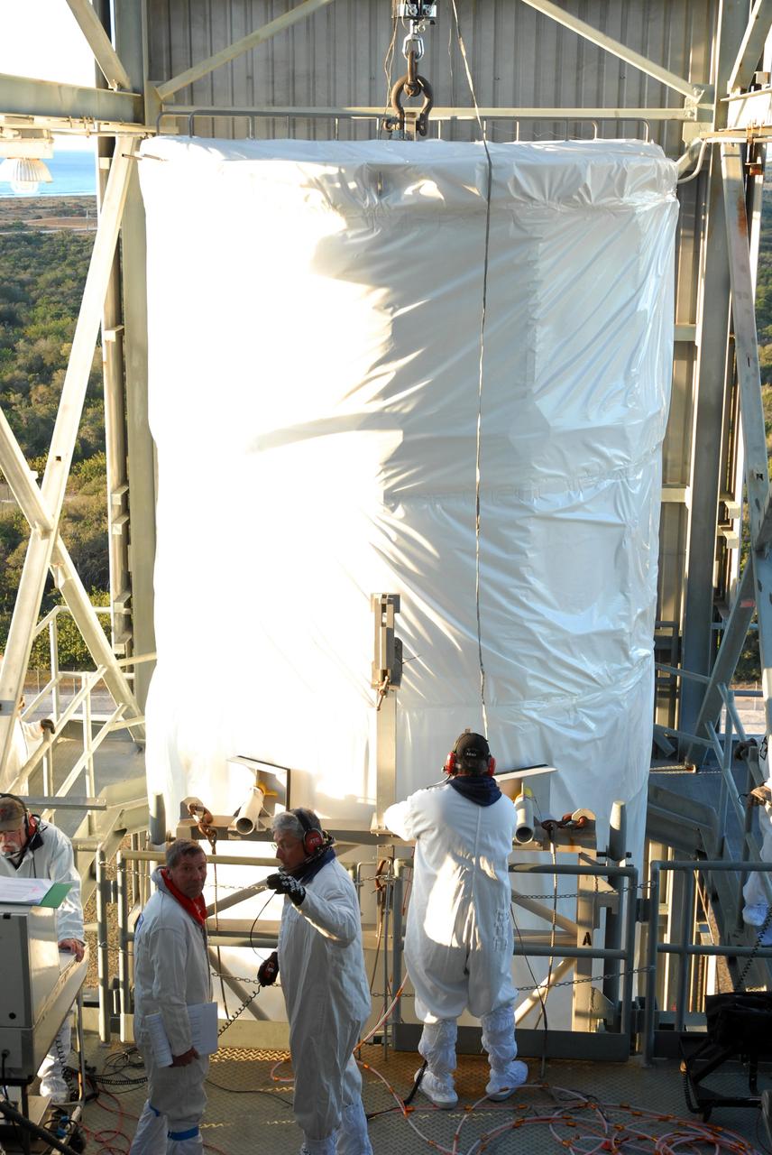 CAPE CANAVERAL, Fla. – On Launch pad 17-B at Cape Canaveral Air Force Station in Florida, NASA's Kepler spacecraft arrives at the transfer level of the mobile service tower. Kepler will be moved inside for mating with the Delta II rocket for launch. The liftoff of Kepler is currently scheduled for 10:48 p.m. EST March 5. Kepler is designed to survey more than 100,000 stars in our galaxy to determine the number of sun-like stars that have Earth-size and larger planets, including those that lie in a star's "habitable zone," a region where liquid water, and perhaps life, could exist. If these Earth-size worlds do exist around stars like our sun, Kepler is expected to be the first to find them and the first to measure how common they are. Photo credit: NASA/Jack Pfaller