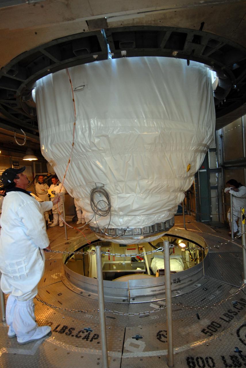 CAPE CANAVERAL, Fla. – On Launch pad 17-B at Cape Canaveral Air Force Station in Florida, NASA's Kepler spacecraft is lowered toward the upper stage of the Delta II rocket. The spacecraft and the rocket will be mated for launch. The liftoff of Kepler is currently scheduled for 10:48 p.m. EST March 5. Kepler is designed to survey more than 100,000 stars in our galaxy to determine the number of sun-like stars that have Earth-size and larger planets, including those that lie in a star's "habitable zone," a region where liquid water, and perhaps life, could exist. If these Earth-size worlds do exist around stars like our sun, Kepler is expected to be the first to find them and the first to measure how common they are. Photo credit: NASA/Jack Pfaller