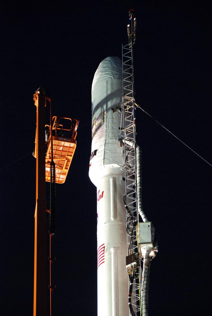 VANDENBERG AIR FORCE BASE, Calif. -- On Launch Complex 576-E at Vandenberg Air Force Base in California, Orbital Sciences' Taurus XL rocket and NASA's Orbiting Carbon Observatory, or OCO, on top, are bathed in light for the night.  The spacecraft has been undergoing final closeouts for launch. OCO is scheduled for launch on the Taurus rocket Feb. 24 from Vandenberg. The spacecraft will collect precise global measurements of carbon dioxide (CO2) in the Earth's atmosphere. Scientists will analyze OCO data to improve our understanding of the natural processes and human activities that regulate the abundance and distribution of this important greenhouse gas.   Photo credit: NASA/Richard Nielsen, VAFB