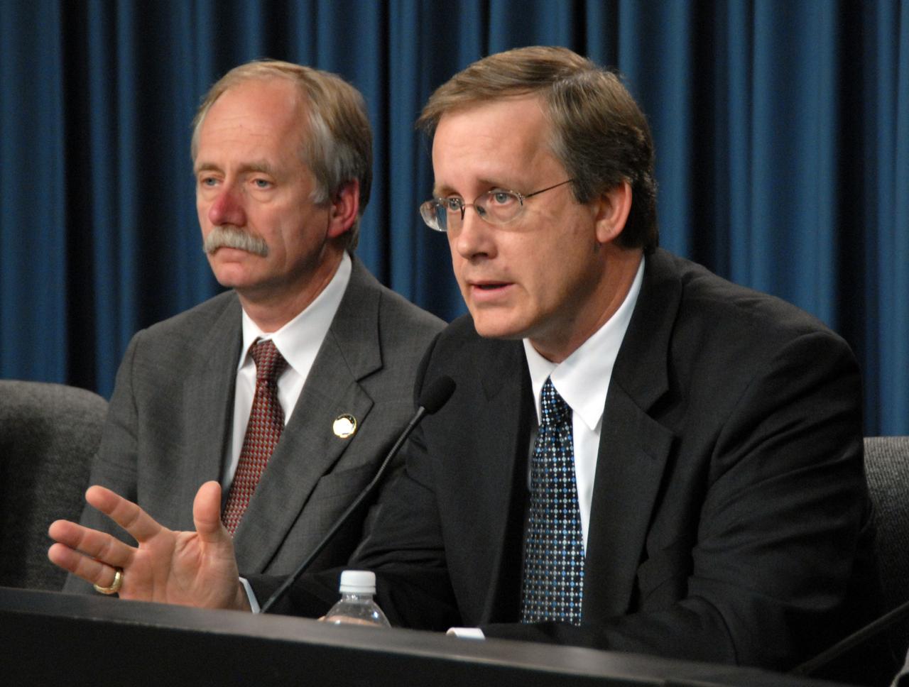 CAPE CANAVERAL, Fla. – At the flight readiness review news conference for space shuttle Discovery's STS-119 mission, Space Shuttle Program Manager John Shannon (right) talks about the discussion surrounding Discovery's readiness for flight. At left is Associate Administrator for Space Operations Bill Gerstenmaier. NASA managers decided Feb. 20 more data and possible testing are required before proceeding to launch. Engineering teams have been working to identify what caused damage to a flow control valve on shuttle Endeavour during its November 2008 flight. A new launch date has not been determined. Photo credit: NASA/Glenn Benson