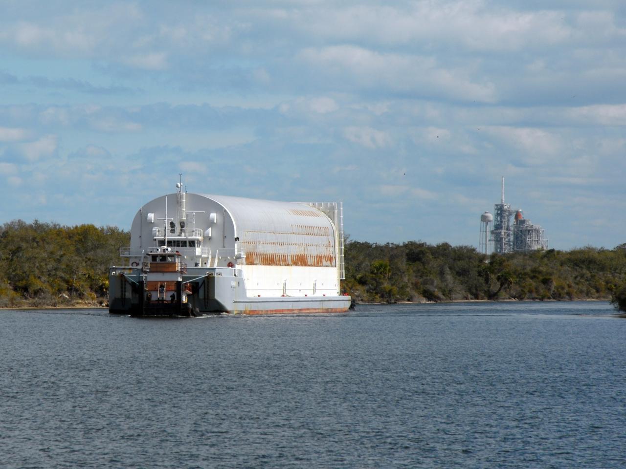 CAPE CANAVERAL, Fla. – At NASA's Kennedy Space Center in Florida, the Pegasus barge arrives in the turn basin to deliver its cargo of the external fuel tank ET-131. The tank will be taken off and moved to the Vehicle Assembly Building. ET-131 will be used on space shuttle Endeavour's STS-127 mission. The Japanese Experiment Module's Experiment Logistics Module-Exposed Section, or ELM-ES, is part of the payload on the STS-127 mission, targeted for launch in June. Photo credit: NASA/Tim Jacobs
