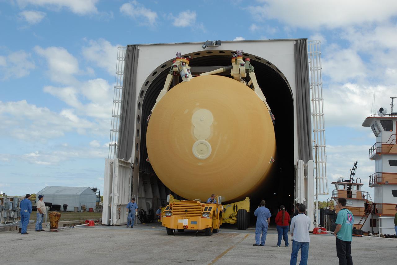 CAPE CANAVERAL, Fla. – At the turn basin at NASA's Kennedy Space Center in Florida, external fuel tank ET-131 is moved out of the Pegasus barge. The tank, which will be used on the STS-127 mission, will be transported to a high bay in the Vehicle Assembly Building for checkout. The Japanese Experiment Module's Experiment Logistics Module-Exposed Section, or ELM-ES, is part of the payload on the STS-127 mission, targeted for launch in June. Photo credit: NASA/Tim Jacobs