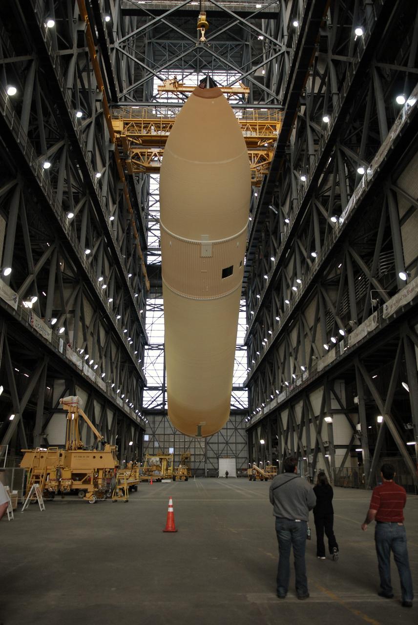 CAPE CANAVERAL, Fla. – In the transfer aisle of the Vehicle Assembly Building at NASA's Kennedy Space Center in Florida, external fuel tank ET-131 is being raised to a vertical position.  It will be lifted into the upper levels and lowered into a checkout bay.  ET-131 will be used on space shuttle Endeavour's  STS-127 mission.  Payload for the mission is the Japanese Experiment Module's Experiment Logistics Module-Exposed Section, or ELM-ES.  Launch is targeted for June.  Photo credit: NASA/Kim Shiflett