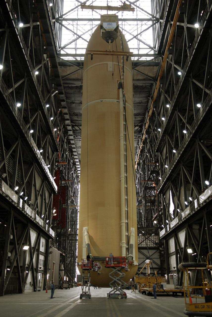 CAPE CANAVERAL, Fla. – In the Vehicle Assembly Building at NASA's Kennedy Space Center in Florida, external fuel tank ET-131 is suspended by a crane over the transfer aisle. It will be lifted into the upper levels and lowered into a checkout bay.  ET-131 will be used on space shuttle Endeavour's  STS-127 mission.  Payload for the mission is the Japanese Experiment Module's Experiment Logistics Module-Exposed Section, or ELM-ES.  Launch is targeted for June.  Photo credit: NASA/Kim Shiflett