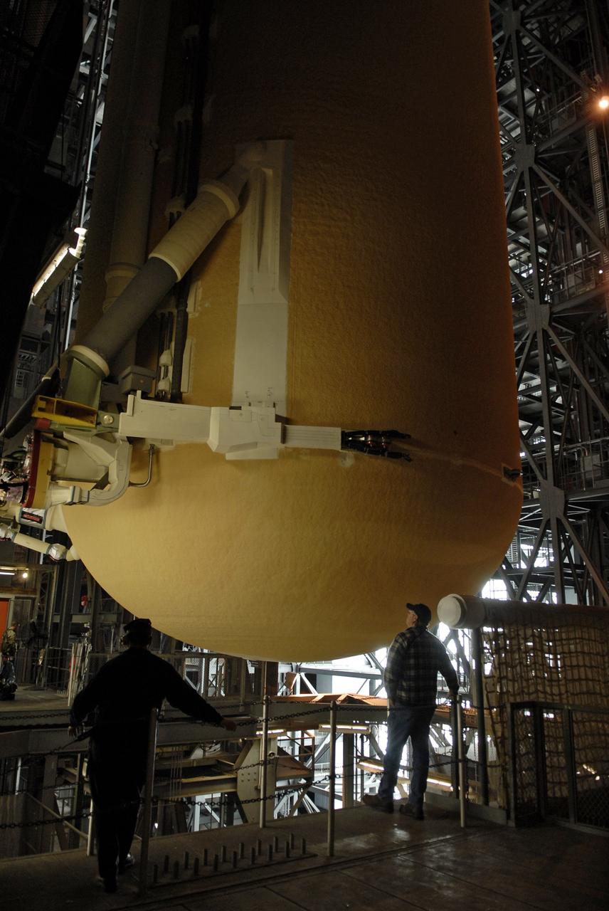 CAPE CANAVERAL, Fla. – In the Vehicle Assembly Building at NASA's Kennedy Space Center in Florida, workers check the progress of external fuel tank ET-131 as it is lowered into a high bay for checkout. ET-131 will be used on space shuttle Endeavour's  STS-127 mission.  Payload for the mission is the Japanese Experiment Module's Experiment Logistics Module-Exposed Section, or ELM-ES.  Launch is targeted for June.  Photo credit: NASA/Kim Shiflett