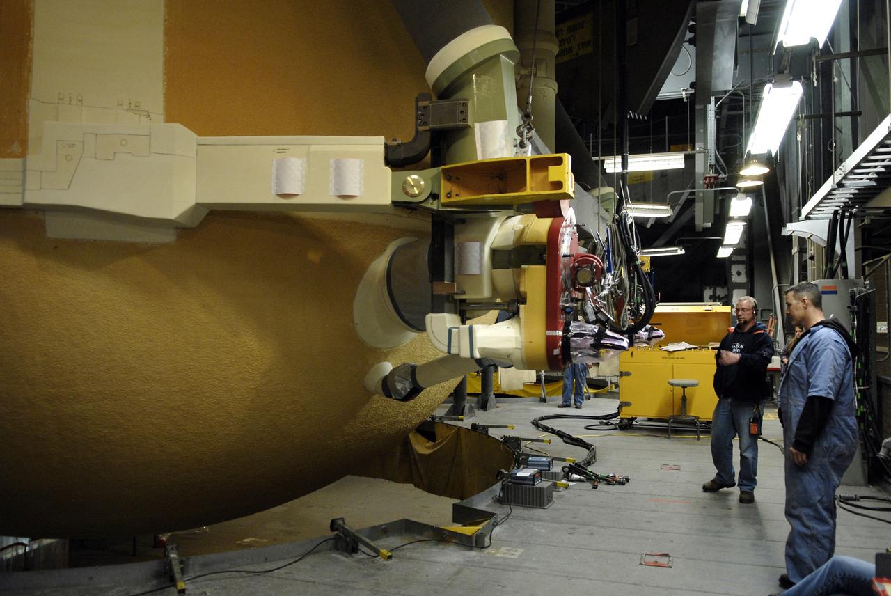 CAPE CANAVERAL, Fla. – In the Vehicle Assembly Building at NASA's Kennedy Space Center in Florida, workers check the progress of external fuel tank ET-131 as it is lowered into a high bay for checkout. ET-131 will be used on space shuttle Endeavour's  STS-127 mission.  Payload for the mission is the Japanese Experiment Module's Experiment Logistics Module-Exposed Section, or ELM-ES.  Launch is targeted for June.  Photo credit: NASA/Kim Shiflett