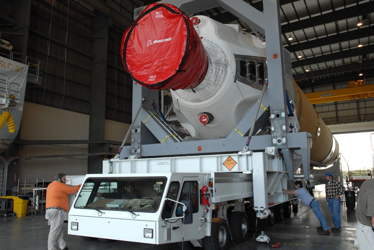 CAPE CANAVERAL, Fla. – On Complex 37 at Cape Canaveral Air Force Station in Florida, workers are ready to move the GOES-O and Delta IV second stage out of the Horizontal Integration Facility to go to the launch pad. GOES–O is one of a series of Geostationary Operational Environmental Satellites. The multi-mission GOES series N-P will be a vital contributor to weather, solar and space operations and science. NASA and the National Oceanic and Atmospheric Administration, or NOAA, are actively engaged in a cooperative program to expand the existing GOES system with the launch of the GOES N-P satellites. Launch of the GOES-O is targeted for no earlier than April 2009. Photo credit: NASA/Jim Grossmann