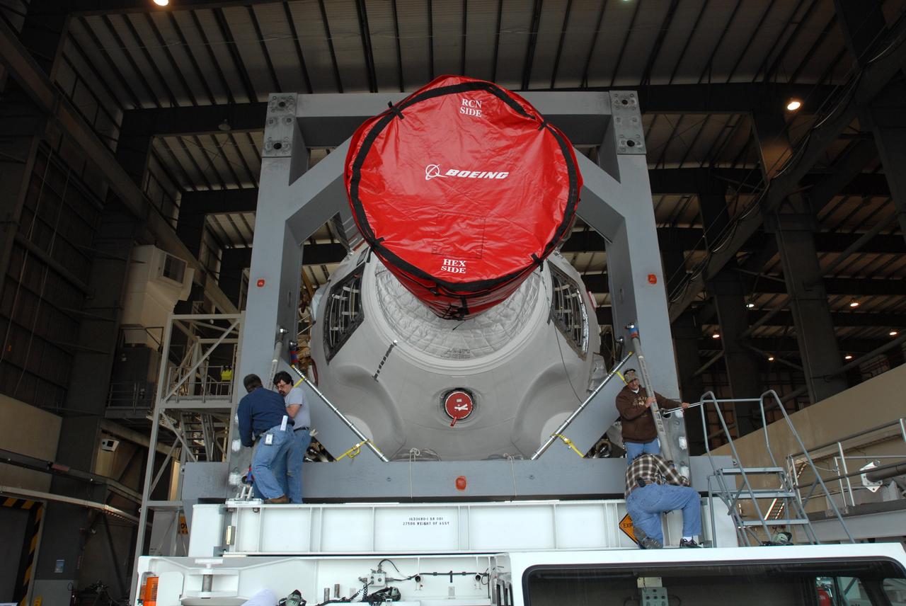 CAPE CANAVERAL, Fla. – On Complex 37 at Cape Canaveral Air Force Station in Florida, workers ensure the GOES-O and Delta IV second stage are ready to leave the Horizontal Integration Facility for the launch pad. GOES–O is one of a series of Geostationary Operational Environmental Satellites. The multi-mission GOES series N-P will be a vital contributor to weather, solar and space operations and science. NASA and the National Oceanic and Atmospheric Administration, or NOAA, are actively engaged in a cooperative program to expand the existing GOES system with the launch of the GOES N-P satellites. Launch of the GOES-O is targeted for no earlier than April 2009. Photo credit: NASA/Jim Grossmann