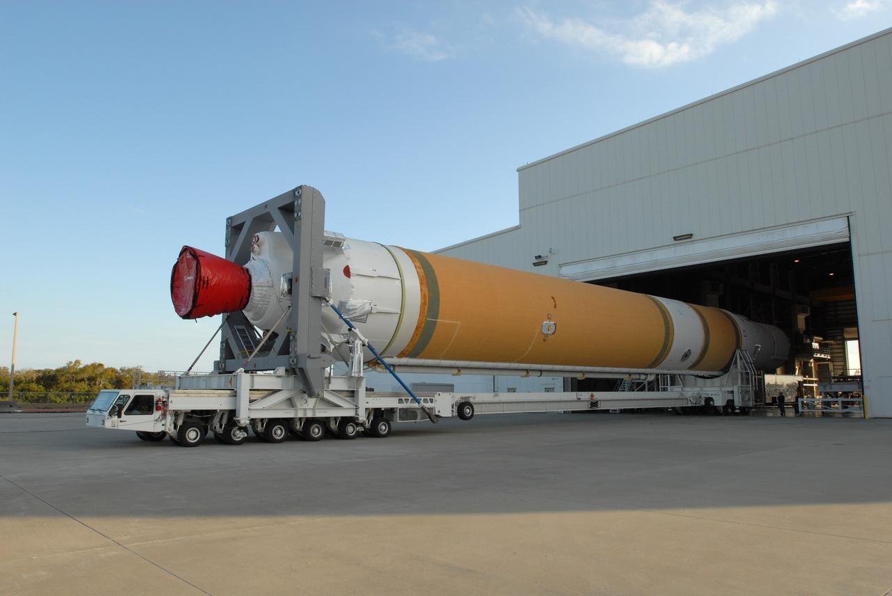 CAPE CANAVERAL, Fla. – On Complex 37 at Cape Canaveral Air Force Station in Florida, the GOES-O and Delta IV second stage begin rolling out of the Horizontal Integration Facility aboard a transporter. They will be moved to the launch pad. GOES–O is one of a series of Geostationary Operational Environmental Satellites. The multi-mission GOES series N-P will be a vital contributor to weather, solar and space operations and science. NASA and the National Oceanic and Atmospheric Administration, or NOAA, are actively engaged in a cooperative program to expand the existing GOES system with the launch of the GOES N-P satellites. Launch of the GOES-O is targeted for no earlier than April 2009. Photo credit: NASA/Jim Grossmann