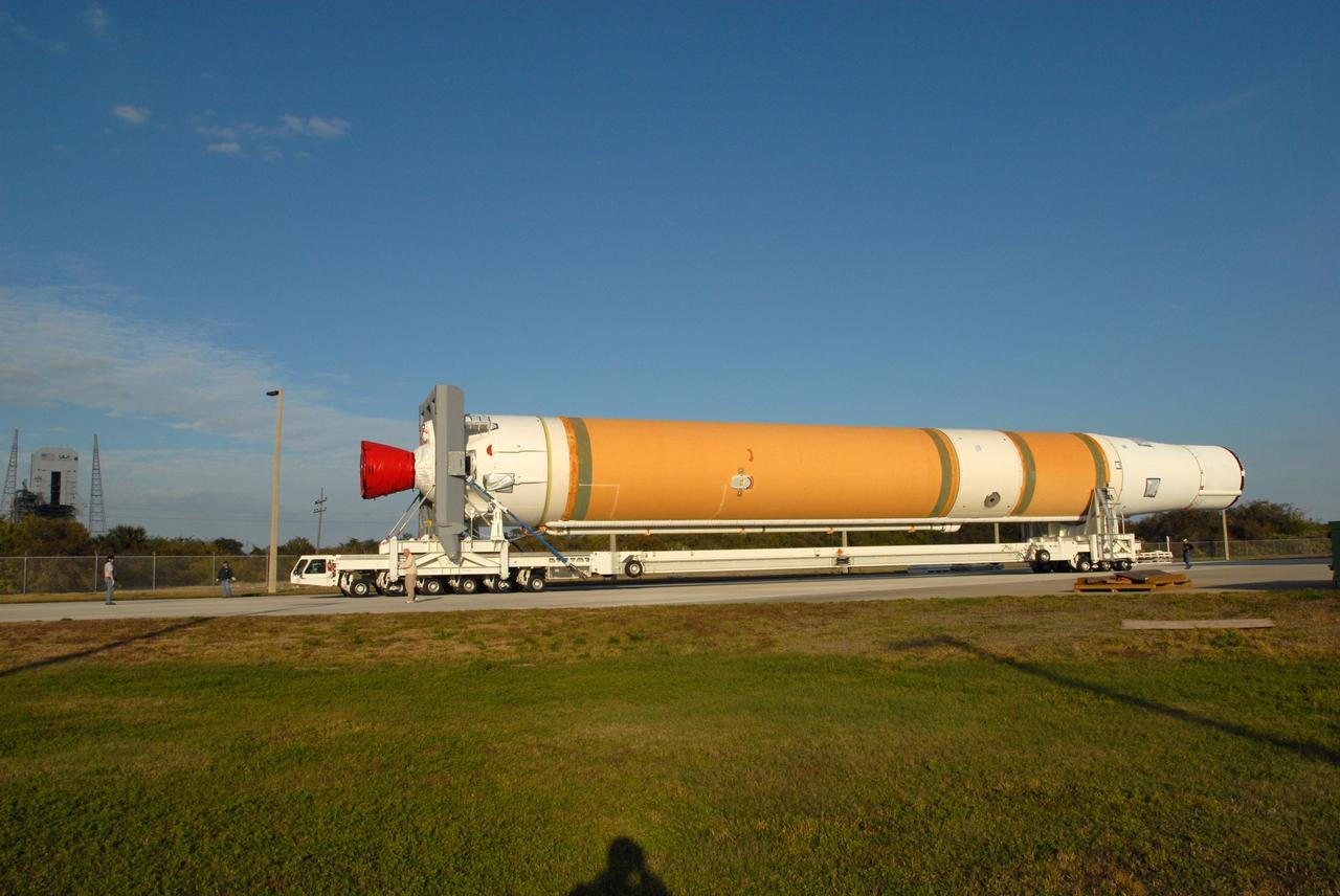 CAPE CANAVERAL, Fla. – On Complex 37 at Cape Canaveral Air Force Station in Florida, the GOES-O and Delta IV second stage roll out of the Horizontal Integration Facility aboard a transporter. They are being moved to the launch pad. GOES–O is one of a series of Geostationary Operational Environmental Satellites. The multi-mission GOES series N-P will be a vital contributor to weather, solar and space operations and science. NASA and the National Oceanic and Atmospheric Administration, or NOAA, are actively engaged in a cooperative program to expand the existing GOES system with the launch of the GOES N-P satellites. Launch of the GOES-O is targeted for no earlier than April 2009. Photo credit: NASA/Jim Grossmann