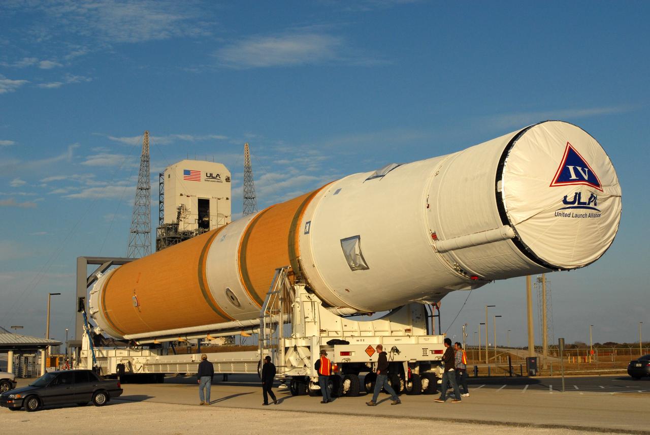 CAPE CANAVERAL, Fla. – At Cape Canaveral Air Force Station in Florida, the GOES-O and Delta IV second stage are transported to Launch Pad 37. GOES–O is one of a series of Geostationary Operational Environmental Satellites. The multi-mission GOES series N-P will be a vital contributor to weather, solar and space operations and science. NASA and the National Oceanic and Atmospheric Administration, or NOAA, are actively engaged in a cooperative program to expand the existing GOES system with the launch of the GOES N-P satellites. Launch of the GOES-O is targeted for no earlier than April 2009. Photo credit: NASA/Jim Grossmann