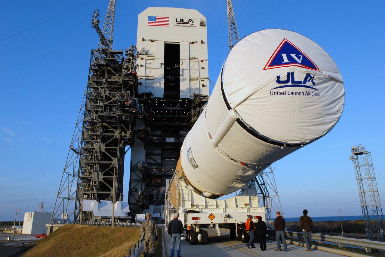 CAPE CANAVERAL, Fla. – At Cape Canaveral Air Force Station in Florida, the GOES-O and Delta IV second stage near the mobile service tower on Launch Pad 37. They will be raised to vertical and moved into the tower. GOES–O is one of a series of Geostationary Operational Environmental Satellites. The multi-mission GOES series N-P will be a vital contributor to weather, solar and space operations and science. NASA and the National Oceanic and Atmospheric Administration, or NOAA, are actively engaged in a cooperative program to expand the existing GOES system with the launch of the GOES N-P satellites. Launch of the GOES-O is targeted for no earlier than April 2009. Photo credit: NASA/Jim Grossmann