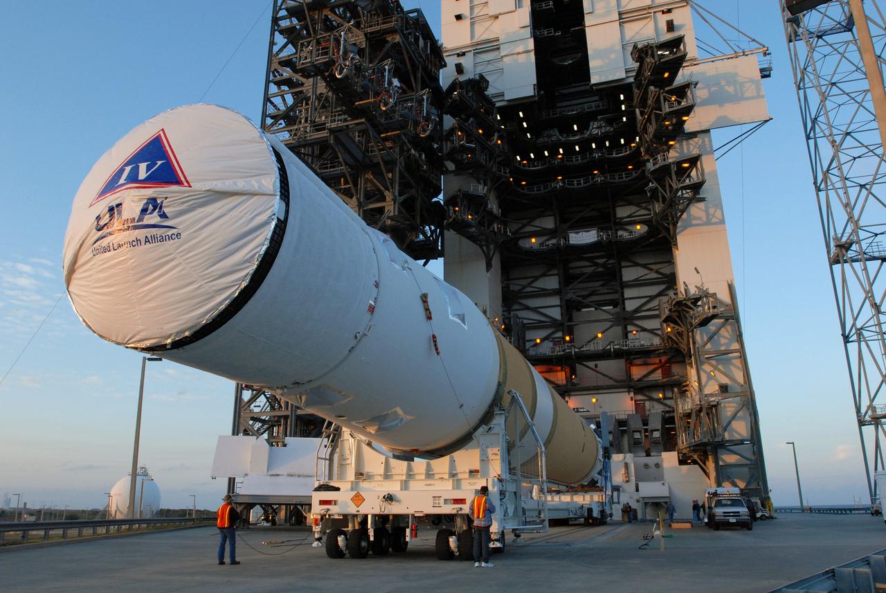 CAPE CANAVERAL, Fla. – At Cape Canaveral Air Force Station in Florida, the GOES-O and Delta IV second stage near the mobile service tower on Launch Pad 37. They will be raised to vertical and moved into the tower. GOES–O is one of a series of Geostationary Operational Environmental Satellites. The multi-mission GOES series N-P will be a vital contributor to weather, solar and space operations and science. NASA and the National Oceanic and Atmospheric Administration, or NOAA, are actively engaged in a cooperative program to expand the existing GOES system with the launch of the GOES N-P satellites. Launch of the GOES-O is targeted for no earlier than April 2009. Photo credit: NASA/Jim Grossmann