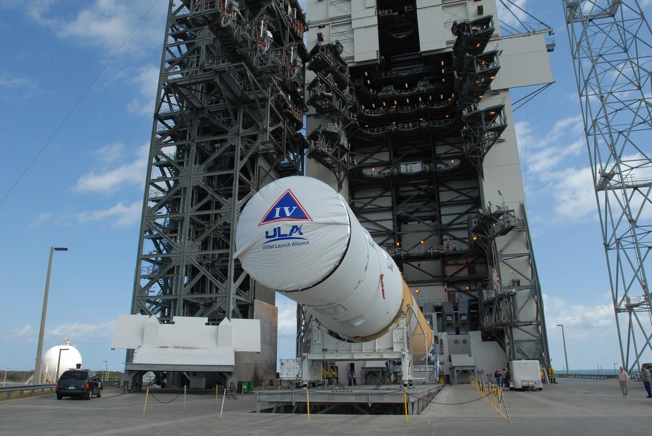 CAPE CANAVERAL, Fla. – On Launch Pad 37 at Cape Canaveral Air Force Station in Florida, the GOES-O and Delta IV upper stage are being raised to vertical. They will be moved into the mobile service tower for prelaunch preparations. GOES–O is one of a series of Geostationary Operational Environmental Satellites. The multi-mission GOES series N-P will be a vital contributor to weather, solar and space operations and science. NASA and the National Oceanic and Atmospheric Administration, or NOAA, are actively engaged in a cooperative program to expand the existing GOES system with the launch of the GOES N-P satellites. Launch of the GOES-O is targeted for no earlier than April 2009. Photo credit: NASA/Jim Grossmann