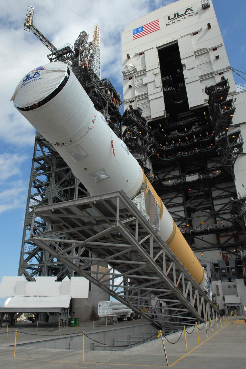 CAPE CANAVERAL, Fla. – On Launch Pad 37 at Cape Canaveral Air Force Station in Florida, the GOES-O and Delta IV upper stage are being raised to vertical. They will be moved into the mobile service tower for prelaunch preparations. GOES–O is one of a series of Geostationary Operational Environmental Satellites. The multi-mission GOES series N-P will be a vital contributor to weather, solar and space operations and science. NASA and the National Oceanic and Atmospheric Administration, or NOAA, are actively engaged in a cooperative program to expand the existing GOES system with the launch of the GOES N-P satellites. Launch of the GOES-O is targeted for no earlier than April 2009. Photo credit: NASA/Jim Grossmann