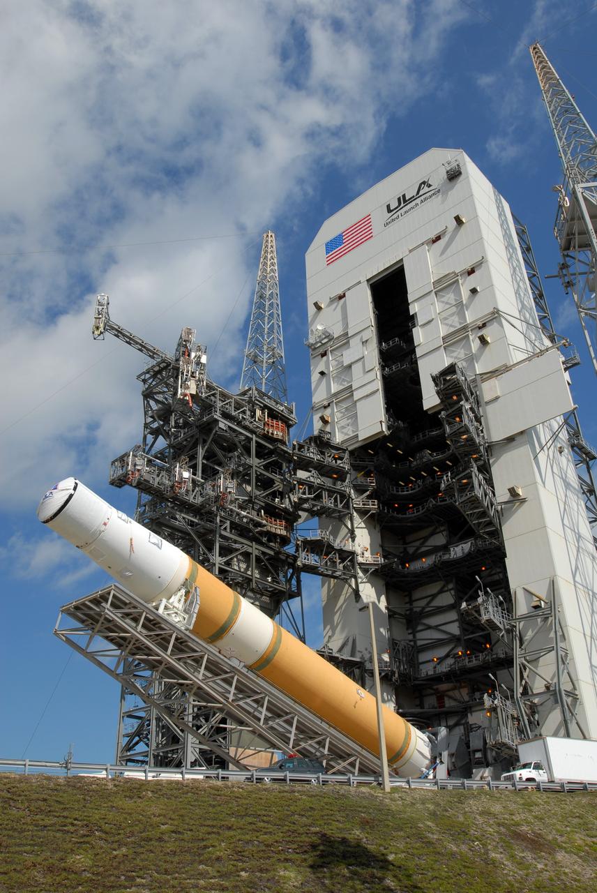 CAPE CANAVERAL, Fla. – On Launch Pad 37 at Cape Canaveral Air Force Station in Florida, the GOES-O and Delta IV upper stage are being raised to vertical. They will be moved into the mobile service tower for prelaunch preparations. GOES–O is one of a series of Geostationary Operational Environmental Satellites. The multi-mission GOES series N-P will be a vital contributor to weather, solar and space operations and science. NASA and the National Oceanic and Atmospheric Administration, or NOAA, are actively engaged in a cooperative program to expand the existing GOES system with the launch of the GOES N-P satellites. Launch of the GOES-O is targeted for no earlier than April 2009. Photo credit: NASA/Jim Grossmann