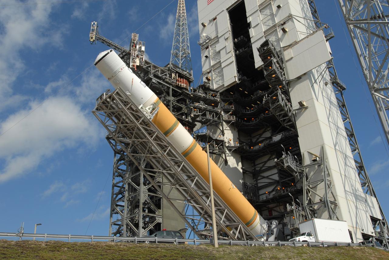 CAPE CANAVERAL, Fla. – On Launch Pad 37 at Cape Canaveral Air Force Station in Florida, the GOES-O and Delta IV upper stage are being raised to vertical. They will be moved into the mobile service tower for prelaunch preparations. GOES–O is one of a series of Geostationary Operational Environmental Satellites. The multi-mission GOES series N-P will be a vital contributor to weather, solar and space operations and science. NASA and the National Oceanic and Atmospheric Administration, or NOAA, are actively engaged in a cooperative program to expand the existing GOES system with the launch of the GOES N-P satellites. Launch of the GOES-O is targeted for no earlier than April 2009. Photo credit: NASA/Jim Grossmann