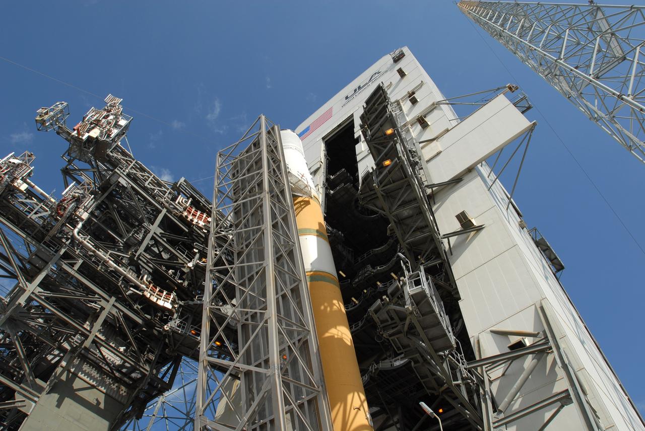 CAPE CANAVERAL, Fla. – On Launch Pad 37 at Cape Canaveral Air Force Station in Florida, the GOES-O and Delta IV upper stage are nearly vertical for movement into the mobile service tower for prelaunch preparations. GOES–O is one of a series of Geostationary Operational Environmental Satellites. The multi-mission GOES series N-P will be a vital contributor to weather, solar and space operations and science. NASA and the National Oceanic and Atmospheric Administration, or NOAA, are actively engaged in a cooperative program to expand the existing GOES system with the launch of the GOES N-P satellites. Launch of the GOES-O is targeted for no earlier than April 2009. Photo credit: NASA/Jim Grossmann