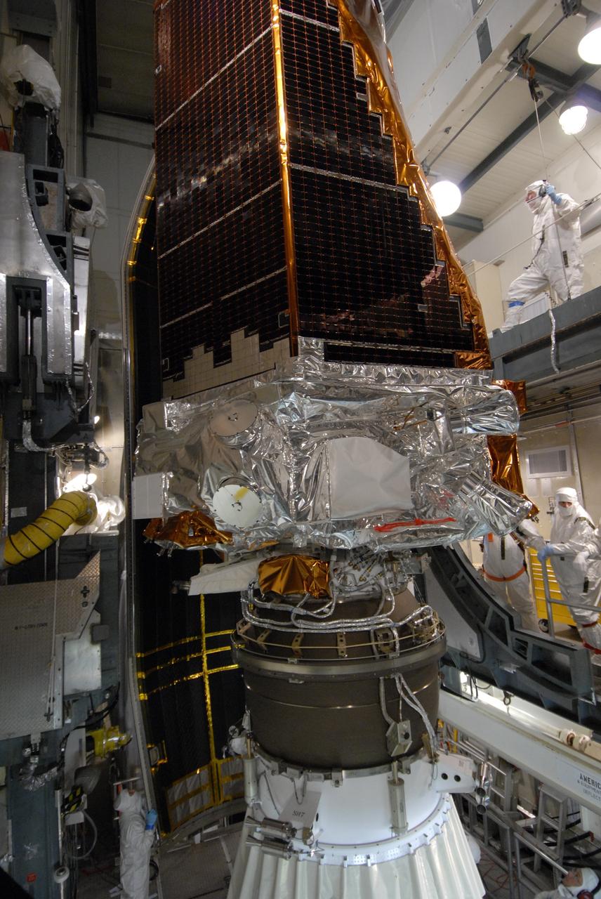 CAPE CANAVERAL, Fla. – On Launch Pad 17-B at Cape Canaveral Air Force Station in Florida, NASA's Kepler spacecraft, atop the United Launch Alliance Delta II rocket, waits for encapsulation in the fairing. The fairing is a molded structure that fits flush with the outside surface of the rocket and forms an aerodynamically smooth nose cone, protecting the spacecraft during launch and ascent. The liftoff of Kepler aboard the Delta II rocket is currently targeted for launch in a window extending 10:49 to 10:52 p.m. EST March 6 from Pad 17-B. Kepler is designed to survey more than 100,000 stars in our galaxy to determine the number of sun-like stars that have Earth-size and larger planets, including those that lie in a star's "habitable zone," a region where liquid water, and perhaps life, could exist. If these Earth-size worlds do exist around stars like our sun, Kepler is expected to be the first to find them and the first to measure how common they are.  Photo credit: NASA/Jack Pfaller