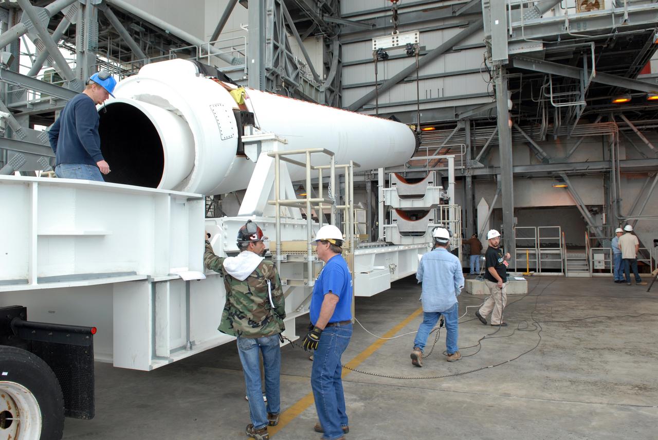 CAPE CANAVERAL, Fla. – One of two solid rocket boosters arrives on Launch Pad 37 at Cape Canaveral Air Force Station. it is the left rocket and it will be lifted into the mobile service tower and mated to the GOES-O Delta IV launch vehicle. GOES–O is one of a series of Geostationary Operational Environmental Satellites. The multi-mission GOES series N-P will be a vital contributor to weather, solar and space operations and science. NASA and the National Oceanic and Atmospheric Administration, or NOAA, are actively engaged in a cooperative program to expand the existing GOES system with the launch of the GOES N-P satellites. Launch of the GOES-O is targeted for no earlier than April 2009. Photo credit: NASA/Ben Smegelsky
