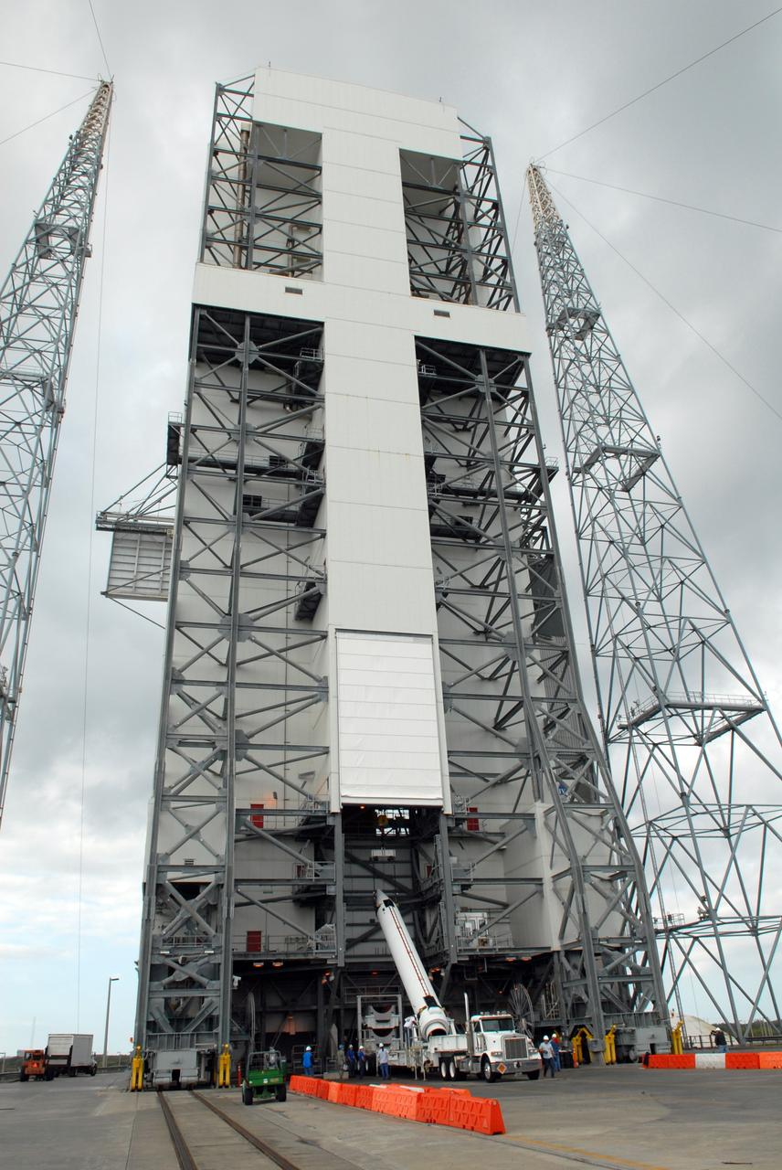 CAPE CANAVERAL, Fla. – One of two solid rocket boosters is lifted into the mobile service tower on Launch Pad 37 at Cape Canaveral Air Force Station. It is the left rocket and it will be mated to the GOES-O Delta IV launch vehicle. GOES–O is one of a series of Geostationary Operational Environmental Satellites. The multi-mission GOES series N-P will be a vital contributor to weather, solar and space operations and science. NASA and the National Oceanic and Atmospheric Administration, or NOAA, are actively engaged in a cooperative program to expand the existing GOES system with the launch of the GOES N-P satellites. Launch of the GOES-O is targeted for no earlier than April 2009. Photo credit: NASA/Ben Smegelsky