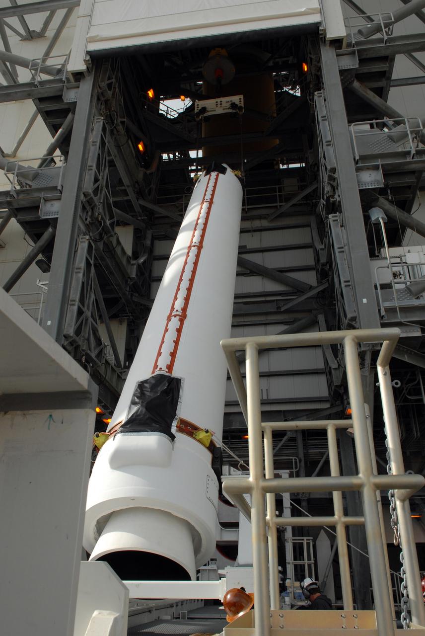 CAPE CANAVERAL, Fla. – One of two solid rocket boosters is lifted into the mobile service tower on Launch Pad 37 at Cape Canaveral Air Force Station. It is the left rocket and it will be mated to the GOES-O Delta IV launch vehicle. GOES–O is one of a series of Geostationary Operational Environmental Satellites. The multi-mission GOES series N-P will be a vital contributor to weather, solar and space operations and science. NASA and the National Oceanic and Atmospheric Administration, or NOAA, are actively engaged in a cooperative program to expand the existing GOES system with the launch of the GOES N-P satellites. Launch of the GOES-O is targeted for no earlier than April 2009. Photo credit: NASA/Ben Smegelsky