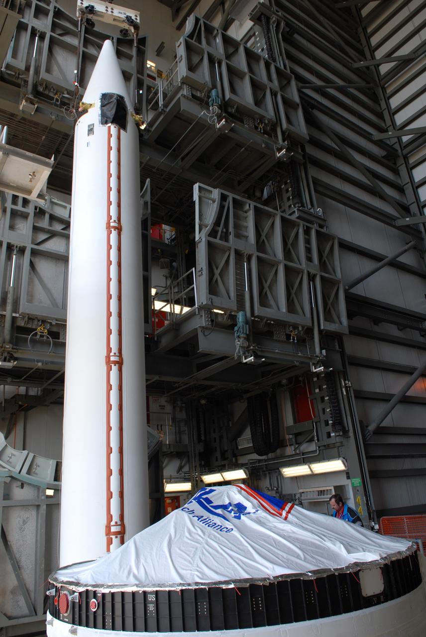 CAPE CANAVERAL, Fla. – One of two solid rocket boosters is lifted into the mobile service tower on Launch Pad 37 at Cape Canaveral Air Force Station.  It is the left rocket and it will be mated to the GOES-O Delta IV launch vehicle. GOES–O is one of a series of Geostationary Operational Environmental Satellites. The multi-mission GOES series N-P will be a vital contributor to weather, solar and space operations and science. NASA and the National Oceanic and Atmospheric Administration, or NOAA, are actively engaged in a cooperative program to expand the existing GOES system with the launch of the GOES N-P satellites. Launch of the GOES-O is targeted for no earlier than April 2009.    Photo credit: NASA/Ben Smegelsky