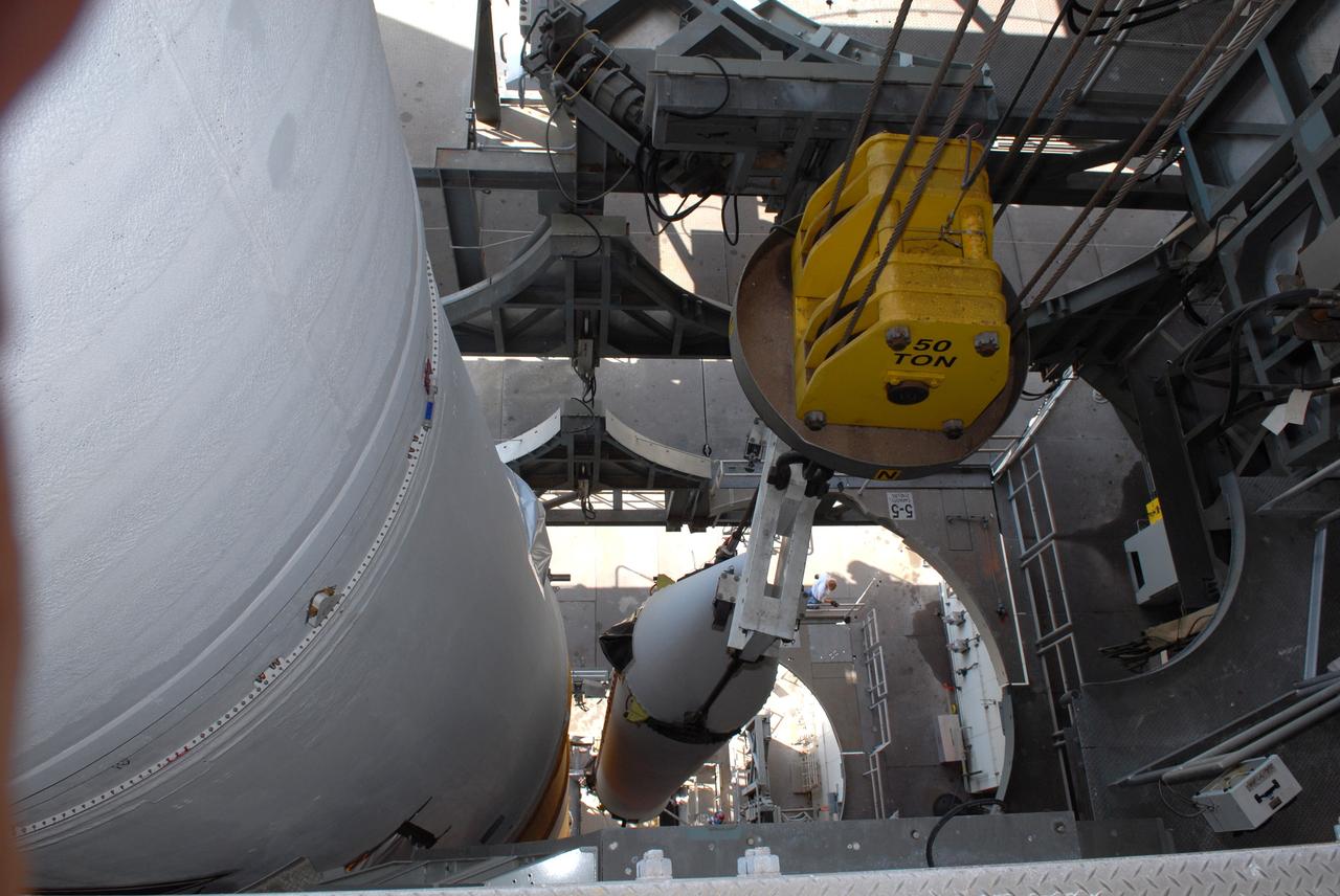 CAPE CANAVERAL, Fla. – One of two solid rocket boosters is mated to the GOES-O Delta IV launch vehicle on Launch Pad 37 at Cape Canaveral Air Force Station. It is the left rocket. GOES–O is one of a series of Geostationary Operational Environmental Satellites. The multi-mission GOES series N-P will be a vital contributor to weather, solar and space operations and science. NASA and the National Oceanic and Atmospheric Administration, or NOAA, are actively engaged in a cooperative program to expand the existing GOES system with the launch of the GOES N-P satellites. Launch of the GOES-O is targeted for no earlier than April 2009. Photo credit: NASA/Ben Smegelsky