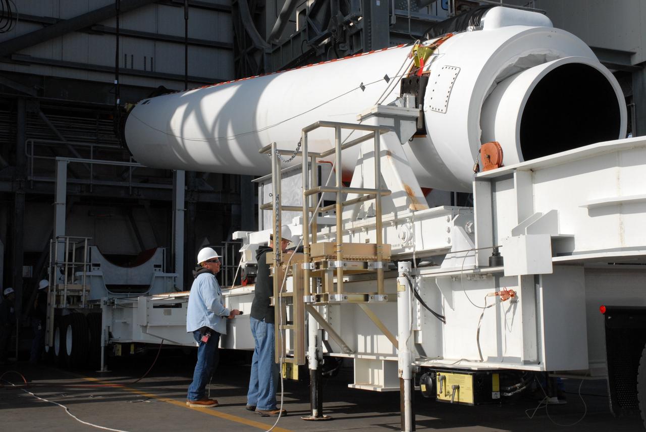 CAPE CANAVERAL, Fla. – On Launch Pad 37 at Cape Canaveral Air Force Station in Florida, the second of two solid rocket boosters is raised from its transporter. The rocket will be lifted into the mobile service tower and installed on the right side of the Delta IV launch vehicle for the GOES-O spacecraft. GOES–O is one of a series of Geostationary Operational Environmental Satellites. The multi-mission GOES series N-P will be a vital contributor to weather, solar and space operations and science. NASA and the National Oceanic and Atmospheric Administration, or NOAA, are actively engaged in a cooperative program to expand the existing GOES system with the launch of the GOES N-P satellites. Launch of the GOES-O is targeted for no earlier than April 2009. Photo credit: NASA/Jack Pfaller