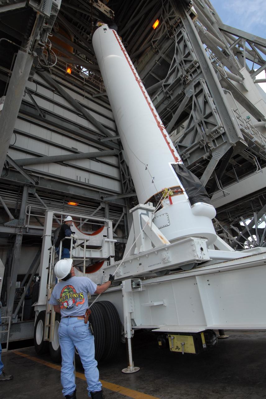 CAPE CANAVERAL, Fla. – On Launch Pad 37 at Cape Canaveral Air Force Station in Florida, the second of two solid rocket boosters is raised from its transporter. The rocket will be lifted into the mobile service tower and installed on the right side of the Delta IV launch vehicle for the GOES-O spacecraft. GOES–O is one of a series of Geostationary Operational Environmental Satellites. The multi-mission GOES series N-P will be a vital contributor to weather, solar and space operations and science. NASA and the National Oceanic and Atmospheric Administration, or NOAA, are actively engaged in a cooperative program to expand the existing GOES system with the launch of the GOES N-P satellites. Launch of the GOES-O is targeted for no earlier than April 2009. Photo credit: NASA/Jack Pfaller