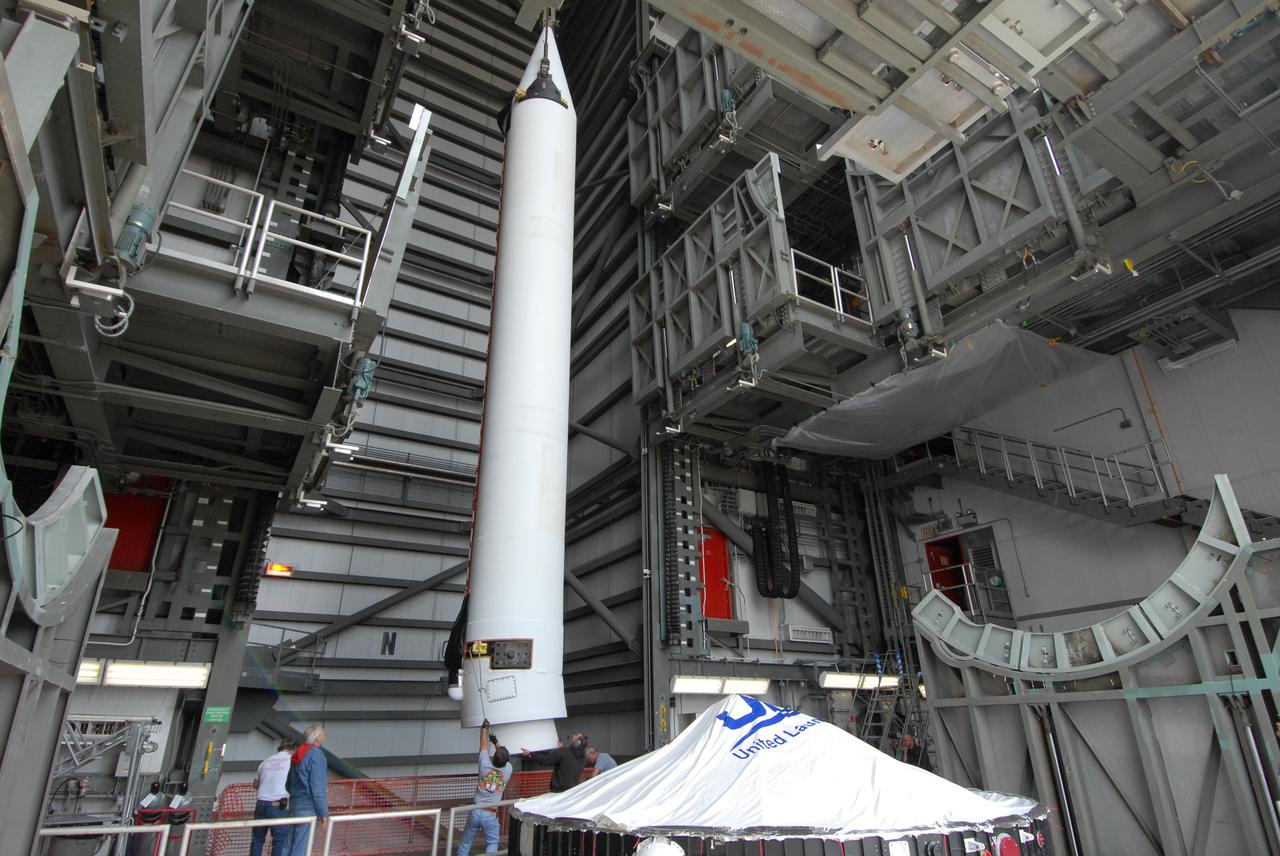 CAPE CANAVERAL, Fla. – On Launch Pad 37 at Cape Canaveral Air Force Station in Florida, the second of two solid rocket boosters is lifted into the mobile service tower. It will be installed on the right side of the Delta IV launch vehicle for the GOES-O spacecraft. GOES–O is one of a series of Geostationary Operational Environmental Satellites. The multi-mission GOES series N-P will be a vital contributor to weather, solar and space operations and science. NASA and the National Oceanic and Atmospheric Administration, or NOAA, are actively engaged in a cooperative program to expand the existing GOES system with the launch of the GOES N-P satellites. Launch of the GOES-O is targeted for no earlier than April 2009. Photo credit: NASA/Jack Pfaller