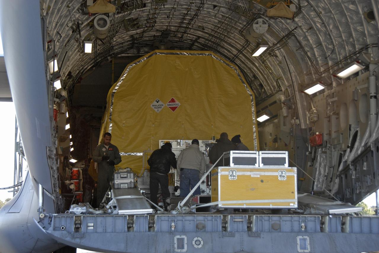 CAPE CANAVERAL, Fla. – The latest Geostationary Operational Environmental Satellite, or GOES, is prepared for offloading from the C-17 military cargo aircraft at the Shuttle Landing Facility at NASA's Kennedy Space Center in Florida. Developed by NASA for the National Oceanic and Atmospheric Administration, or NOAA, the GOES-O satellite is targeted to launch April 28 onboard a United Launch Alliance Delta IV expendable launch vehicle. Once in orbit, GOES-O will be designated GOES-14, and NASA will provide on-orbit checkout and then transfer operational responsibility to NOAA. GOES-O will be placed in on-orbit storage as a replacement for an older GOES satellite. After arriving, the satellite was transported to Astrotech in Titusville, Fla., where final testing of the imaging system, instrumentation, communications and power systems will be performed. Photo credit: NASA/Kim Shiflett