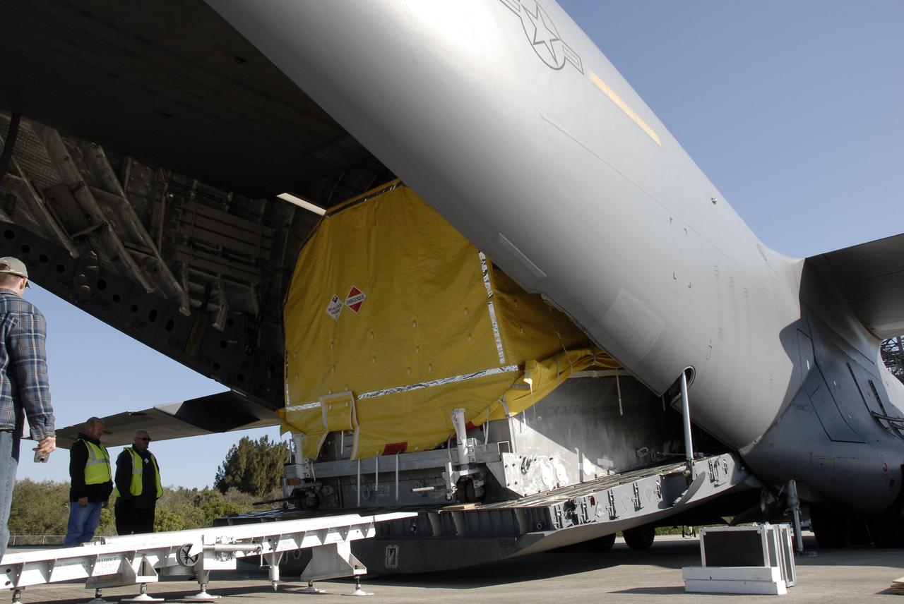 CAPE CANAVERAL, Fla. – The latest Geostationary Operational Environmental Satellite, or GOES, moves out of the C-17 military cargo aircraft at the Shuttle Landing Facility at NASA's Kennedy Space Center in Florida.  Developed by NASA for the National Oceanic and Atmospheric Administration, or NOAA, the GOES-O satellite is targeted to launch April 28 onboard a United Launch Alliance Delta IV expendable launch vehicle. Once in orbit, GOES-O will be designated GOES-14, and NASA will provide on-orbit checkout and then transfer operational responsibility to NOAA. GOES-O will be placed in on-orbit storage as a replacement for an older GOES satellite.  After arriving, the satellite was transported to Astrotech in Titusville, Fla., where final testing of the imaging system, instrumentation, communications and power systems will be performed. Photo credit: NASA/Kim Shiflett