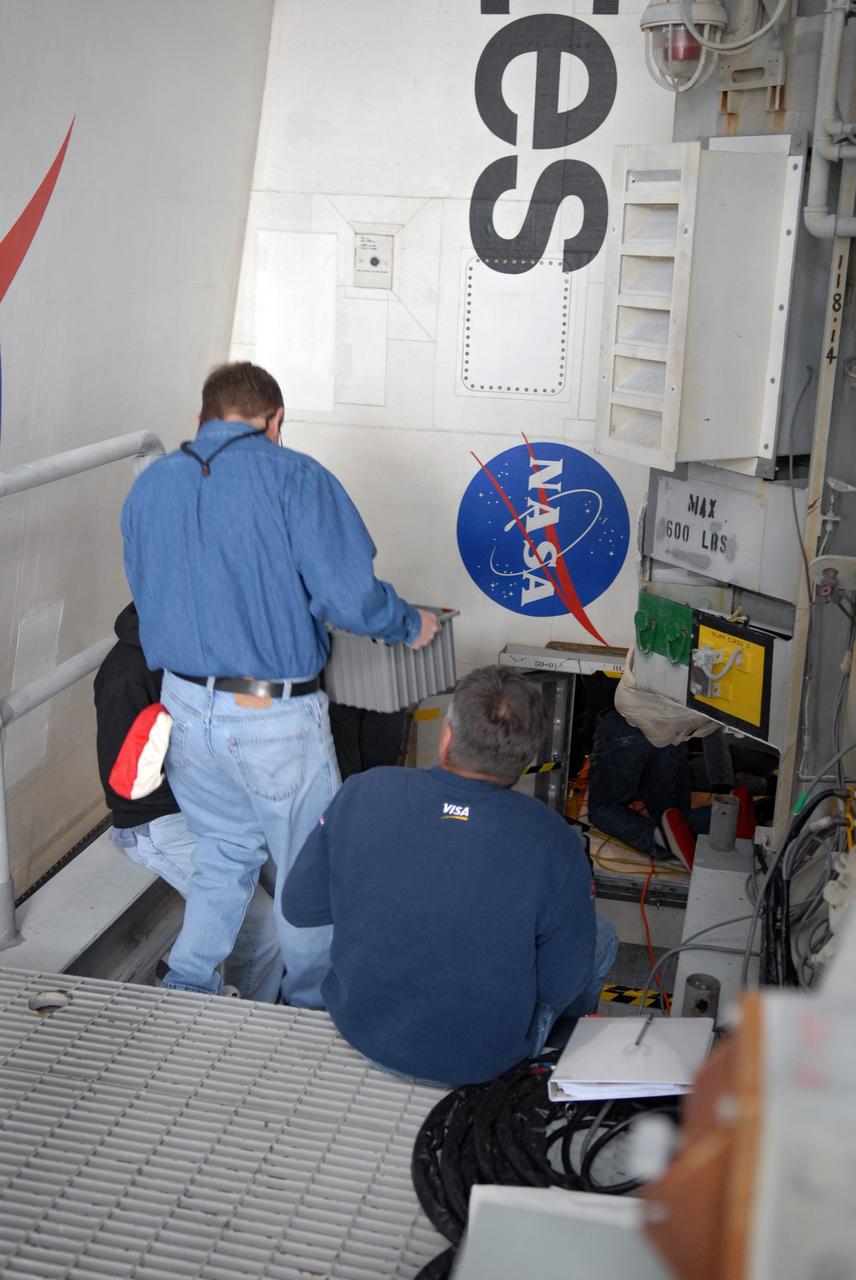 CAPE CANAVERAL, Fla. – On Launch Pad 39A at NASA's Kennedy Space Center in Florida, technicians prepare to install three gaseous hydrogen flow control valves on space shuttle Discovery.  The valves were retested after installation. Part of the main propulsion system, the valves channel gaseous hydrogen from the main engines to the external tank. NASA and contractor teams have worked to identify what caused damage to a flow control valve on shuttle Endeavour during its November 2008 flight.  Space Shuttle Program managers decided to replace Discovery's valves with others that have undergone a detailed eddy current inspection.  Program managers will review the testing and determine whether to meet on March 6 for the Flight Readiness Review for the STS-119 mission.  Launch of Discovery tentatively is targeted for March 12.   Photo credit: NASA/Chris Rhodes