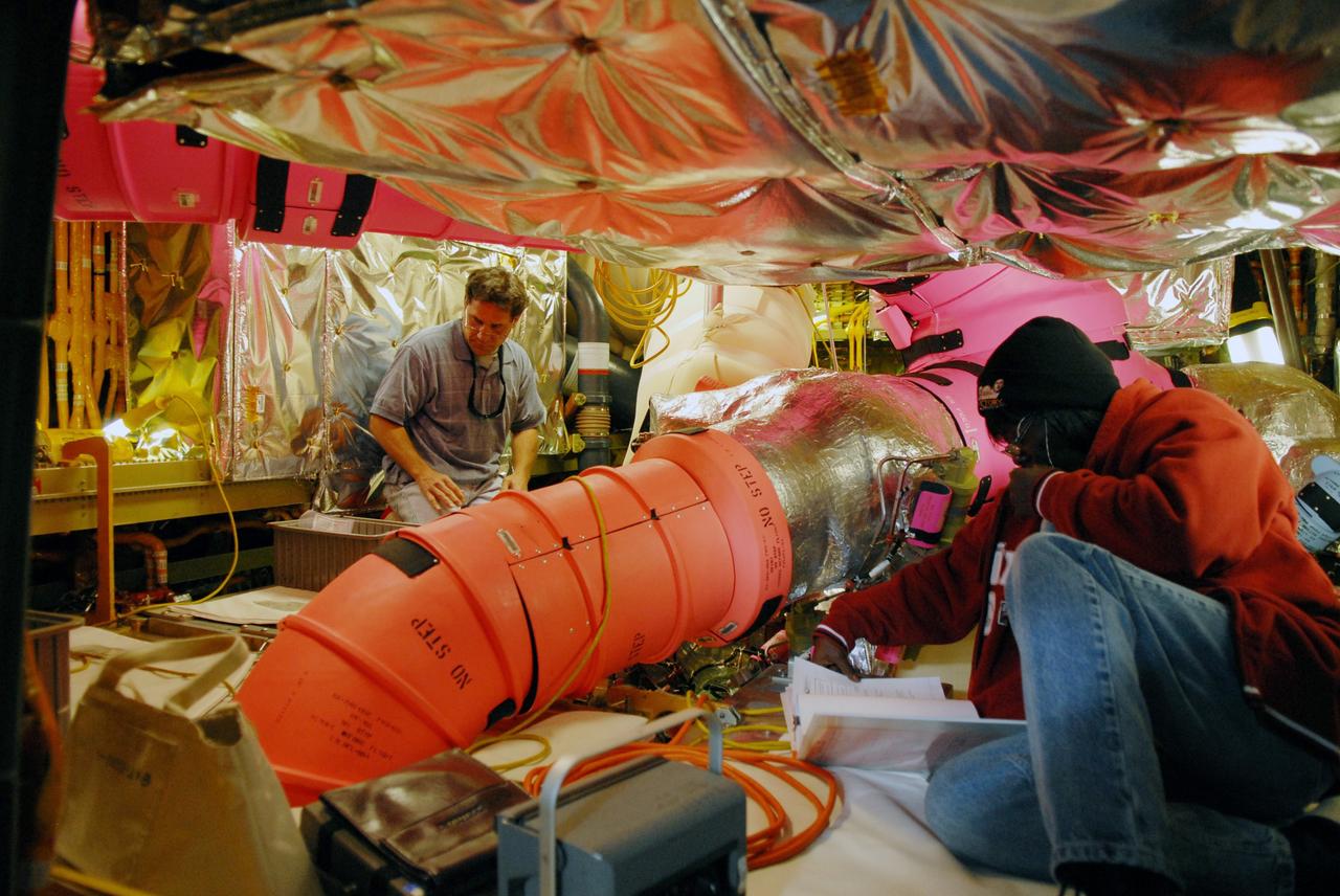 CAPE CANAVERAL, Fla. – On Launch Pad 39A at NASA's Kennedy Space Center in Florida, technicians  install three gaseous hydrogen flow control valves on space shuttle Discovery.  The valves were retested after installation. Part of the main propulsion system, the valves channel gaseous hydrogen from the main engines to the external tank. NASA and contractor teams have worked to identify what caused damage to a flow control valve on shuttle Endeavour during its November 2008 flight.  Space Shuttle Program managers decided to replace Discovery's valves with others that have undergone a detailed eddy current inspection.  Program managers will review the testing and determine whether to meet on March 6 for the Flight Readiness Review for the STS-119 mission.  Launch of Discovery tentatively is targeted for March 12.   Photo credit: NASA/Chris Rhodes