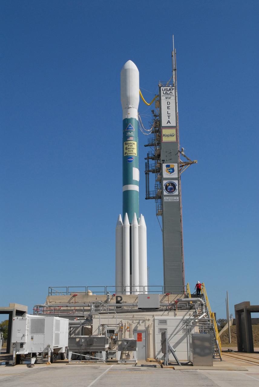 CAPE CANAVERAL, Fla. – The Delta II 7925 rocket stands ready for launch following rollback of the mobile service tower on Launch Pad 17-B at Cape Canaveral Air Force Station in Florida. Atop the rocket is NASA's Kepler spacecraft. Kepler is a spaceborne telescope designed to search the nearby region of our galaxy for Earth-size planets orbiting in the habitable zone of stars like our sun. The habitable zone is the region around a star where temperatures permit water to be liquid on a planet's surface. The challenge for Kepler is to look at a large number of stars in order to statistically estimate the total number of Earth-size planets orbiting sun-like stars in the habitable zone. Kepler will survey more than 100,000 stars in our galaxy. Photo credit: NASA/Jack Pfaller
