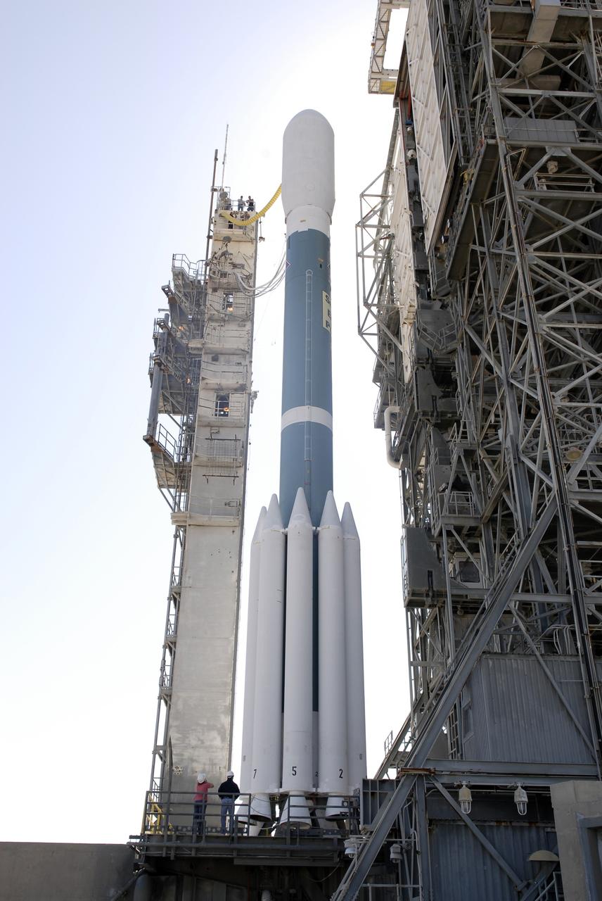 CAPE CANAVERAL, Fla. – The Delta II 7925 rocket stands ready for launch following rollback of the mobile service tower on Launch Pad 17-B at Cape Canaveral Air Force Station in Florida. Atop the rocket is NASA's Kepler spacecraft. Kepler is a spaceborne telescope designed to search the nearby region of our galaxy for Earth-size planets orbiting in the habitable zone of stars like our sun. The habitable zone is the region around a star where temperatures permit water to be liquid on a planet's surface. The challenge for Kepler is to look at a large number of stars in order to statistically estimate the total number of Earth-size planets orbiting sun-like stars in the habitable zone. Kepler will survey more than 100,000 stars in our galaxy. Photo credit: NASA/Jack Pfaller