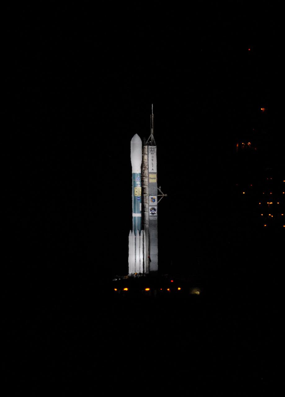 CAPE CANAVERAL, Fla. – United Launch Alliance's Delta II rocket, with NASA's Kepler spacecraft aboard, is bathed in light on Launch Pad 17-B at Cape Canaveral Air Force Station in Florida prior to launch. Liftoff is planned for 10:49 p.m. EST. Kepler is a spaceborne telescope designed to search the nearby region of our galaxy for Earth-size planets orbiting in the habitable zone of stars like our sun. The habitable zone is the region around a star where temperatures permit water to be liquid on a planet's surface. The challenge for Kepler is to look at a large number of stars in order to statistically estimate the total number of Earth-size planets orbiting sun-like stars in the habitable zone. Kepler will survey more than 100,000 stars in our galaxy. Photo credit: NASA/Jack Pfaller