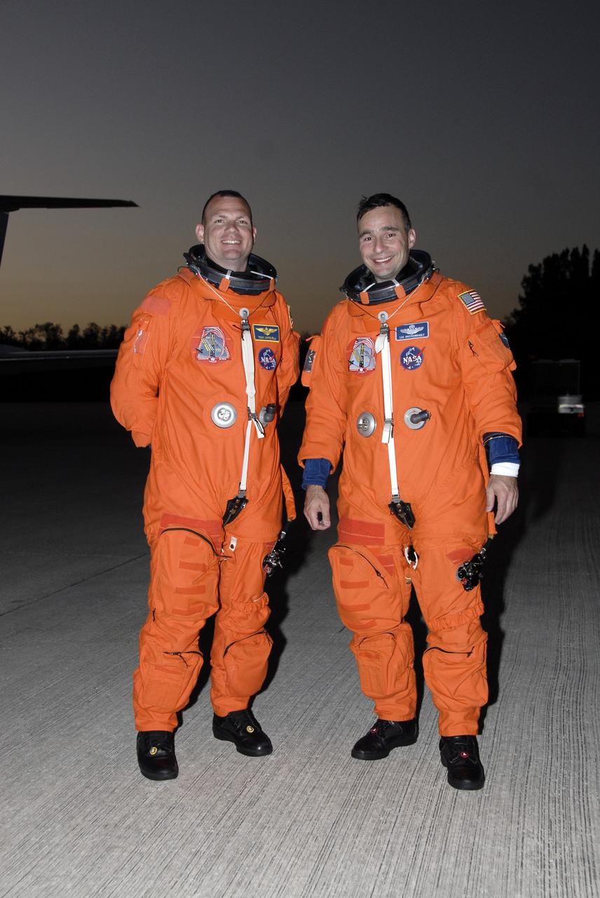 CAPE CANAVERAL, Fla. – STS-119 Pilot Tony Antonelli (left) and Commander Lee Archambault happily pose for a photo after practicing shuttle landings in Shuttle Training Aircraft at NASA's Kennedy Space Center in Florida. The mission crew members arrived in the afternoon at Kennedy to prepare for launch. The mission is the 28th to the International Space Station and the 125th space shuttle flight.  Space shuttle Discovery will deliver the final pair of power-generating solar array wings and truss element, S6.  Photo credit: NASA/Kim Shiflett