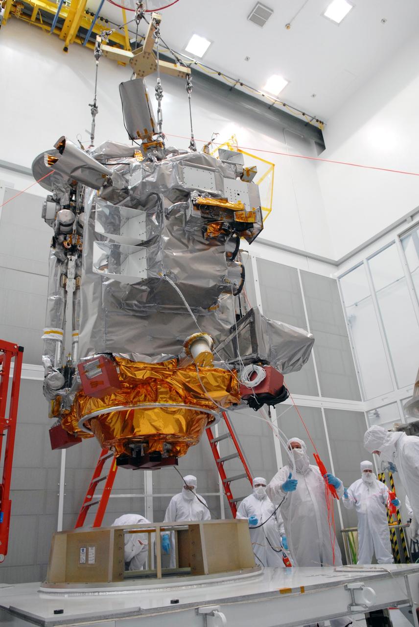 CAPE CANAVERAL, Fla. – At Astrotech in Titusville, Fla., an overhead crane lifts NASA's Lunar Reconnaissance Orbiter, or LRO, from its stand. The orbiter will be moved to an Aronson table nearby for rotation to provide proper access for processing. The orbiter will carry seven instruments to provide scientists with detailed maps of the lunar surface and enhance our understanding of the moon's topography, lighting conditions, mineralogical composition and natural resources. Information gleaned from LRO will be used to select safe landing sites, determine locations for future lunar outposts and help mitigate radiation dangers to astronauts. The polar regions of the moon are the main focus of the mission because continuous access to sunlight may be possible and water ice may exist in permanently shadowed areas of the poles. Accompanying LRO on its journey to the moon will be the Lunar CRater Observation and Sensing Satellite, or LCROSS, a mission that will impact the lunar surface in its search for water ice. Launch of LRO is targeted for May 20. Photo credit: NASA/Jack Pfaller