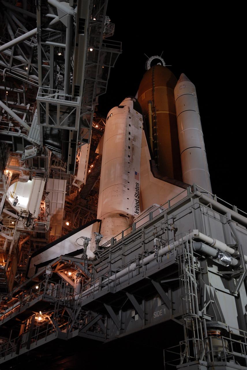 CAPE CANAVERAL, Fla. – On Launch Pad 39A at NASA's Kennedy Space Center in Florida, space shuttle Discovery is revealed after the rotating service structure has been rolled back. The rollback is in preparation for Discovery's liftoff on the STS-119 mission with a crew of seven. The rotating structure provides protected access to the shuttle for changeout and servicing of payloads at the pad. After the RSS is rolled back, the orbiter is ready for fuel cell activation and external tank cryogenic propellant loading operations. The mission is the 28th to the International Space Station and the 125th space shuttle flight.  Discovery will deliver the final pair of power-generating solar array wings and the S6 truss segment.  Installation of S6 will signal the station's readiness to house a six-member crew for conducting increased science.  Liftoff of Discovery is scheduled for 9:20 p.m. EDT on March 11.   Photo credit: NASA/Kim Shiflett