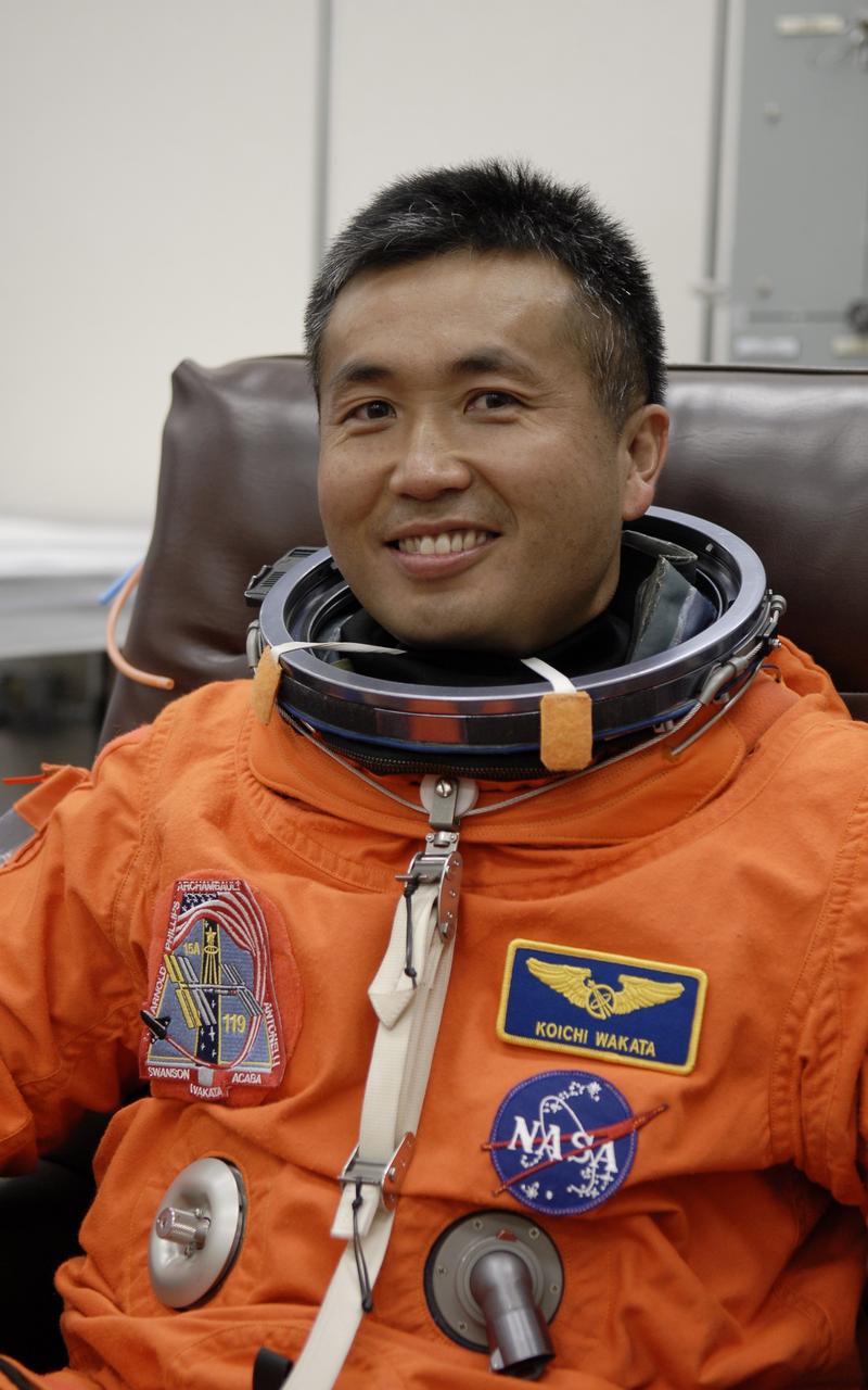 CAPE CANAVERAL, Fla. – In the Operations and Checkout Building at NASA's Kennedy Space Center in Florida, STS-119 Mission Specialist Koichi Wakata is happy to be suiting up for the launch of space shuttle Discovery.  The crew will be heading for Launch Pad 39A and liftoff of Discovery, scheduled for 7:43 p.m. EDT on March 15.  An earlier launch attempt March 11 was scrubbed at 2:36 p.m. due to a gaseous hydrogen leak from the external tank at the Ground Umbilical Carrier Plate during tanking. A seven-inch quick disconnect and two seals were replaced. The STS-119 mission is the 28th to the International Space Station and the 125th space shuttle flight.  Discovery will deliver the final pair of power-generating solar array wings and the S6 truss segment.  Installation of S6 will signal the station's readiness to house a six-member crew for conducting increased science.  Photo credit: NASA/Kim Shiflett