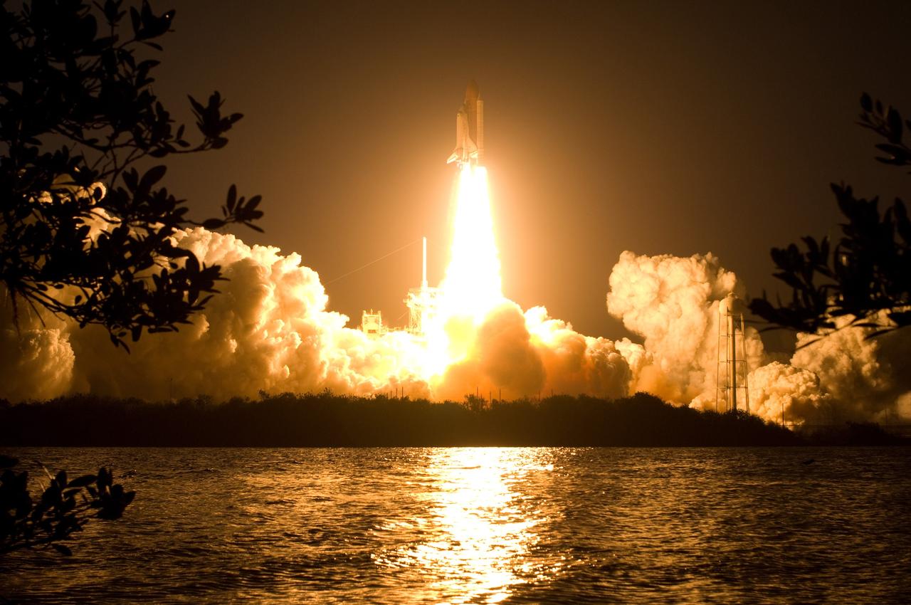CAPE CANAVERAL, Fla. – Billows of smoke and the water near Launch Pad 39A at NASA's Kennedy Space Center in Florida capture the brilliant light of space shuttle Discovery's lift-off on the STS-119 mission.  The launch was on time at 7:43 p.m. EDT.  The STS-119 mission is the 28th to the International Space Station and the 125th space shuttle flight.  Discovery will deliver the final pair of power-generating solar array wings and the S6 truss segment.  Installation of S6 will signal the station's readiness to house a six-member crew for conducting increased science.  Photo credit: NASA/Sandra Joseph, Kevin O'Connell