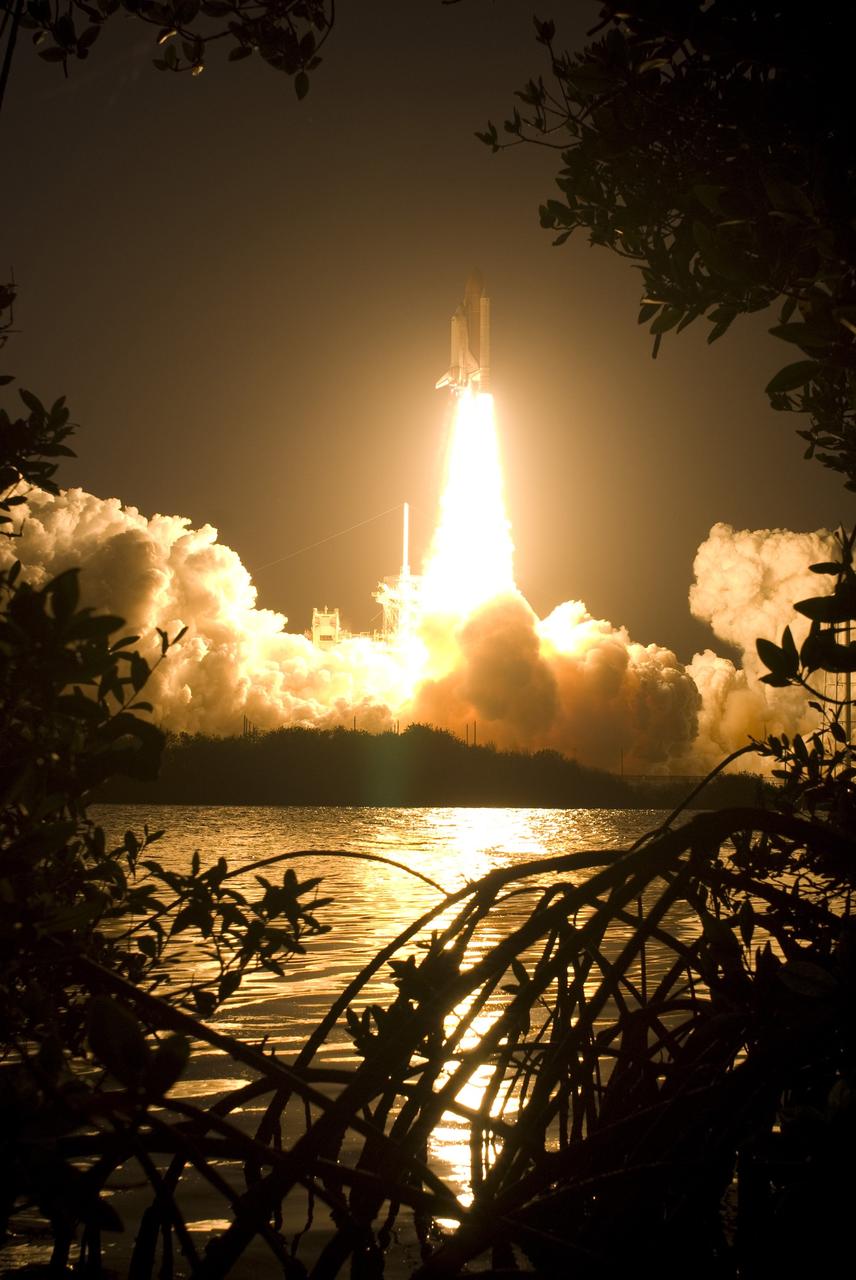 CAPE CANAVERAL, Fla. – Atop a column of fire, space shuttle Discovery roars toward space as it lifts off Launch Pad 39A at NASA's Kennedy Space Center in Florida on the STS-119 mission. The launch was on time at 7:43 p.m. EDT.  The STS-119 mission is the 28th to the International Space Station and the 125th space shuttle flight.  Discovery will deliver the final pair of power-generating solar array wings and the S6 truss segment.  Installation of S6 will signal the station's readiness to house a six-member crew for conducting increased science.  Photo credit: NASA/Sandra Joseph, Kevin O'Connell