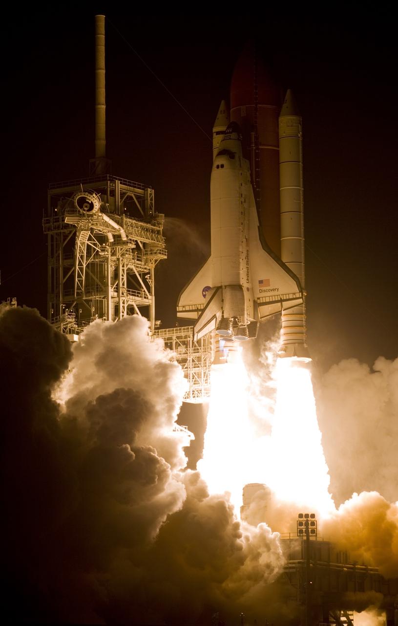 CAPE CANAVERAL, Fla. – At NASA's Kennedy Space Center in Florida, twin columns of fire propel space shuttle Discovery from Launch Pad 39A toward space on mission STS-119.  Launch was on time at 7:43 p.m. EDT.  The STS-119 mission is the 28th to the International Space Station and the 125th space shuttle flight.  Discovery will deliver the final pair of power-generating solar array wings and the S6 truss segment.  Installation of S6 will signal the station's readiness to house a six-member crew for conducting increased science.  Photo courtesy of Scott Andrews