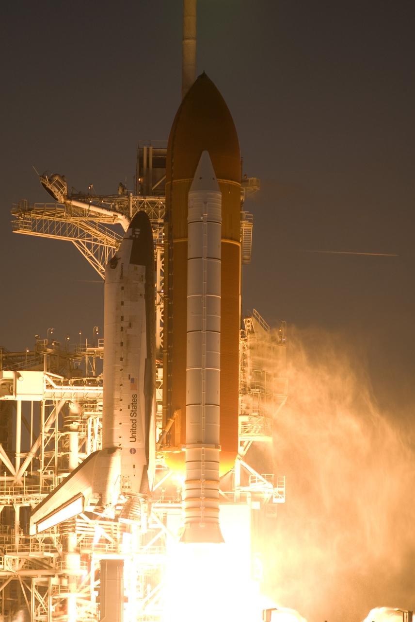 CAPE CANAVERAL, Fla. – Steam rises from Launch Pad 39A at  NASA's Kennedy Space Center in Florida as space shuttle Discovery lifts off on mission STS-119.   Launch was on time at 7:43 p.m. EDT. The STS-119 mission is the 28th to the International Space Station and the 125th space shuttle flight.  Discovery will deliver the final pair of power-generating solar array wings and the S6 truss segment.  Installation of S6 will signal the station's readiness to house a six-member crew for conducting increased science.  Photo credit: NASA/Rusty Backer, George Roberts