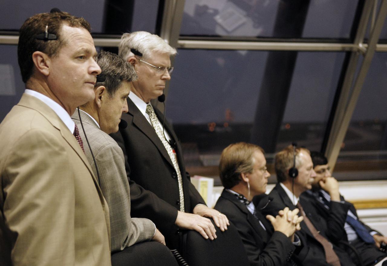 CAPE CANAVERAL, Fla. – In Firing Room 4 of the Launch Control Center at NASA's Kennedy Space Center in Florida, NASA management waits for the launch of space shuttle Discovery on the STS-119 mission.  From left are (standing) Director of NASA's Marshall Space Flight Center Dave King, Center Director Bob Cabana, Director of NASA's Johnson Space Center Michael Coats, (seated) Space Shuttle Program Manager John Shannon, NASA Associate Administrator for Space Operations William Gerstenmaier and NASA Acting Administrator Chris Scolese. Launch was on time at 7:43 p.m. EDT. The STS-119 mission is the 28th to the space station and Discovery's 36th flight.  Discovery will deliver the final pair of power-generating solar array wings and the S6 truss segment.  Installation of S6 will signal the station's readiness to house a six-member crew for conducting increased science.  Photo credit: NASA/Kim Shiflett